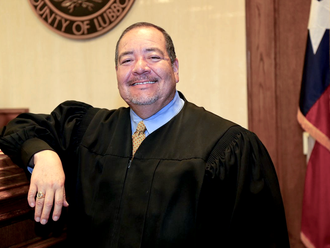 Photo of the Honorable Ruben G. Reyes in the courtroom